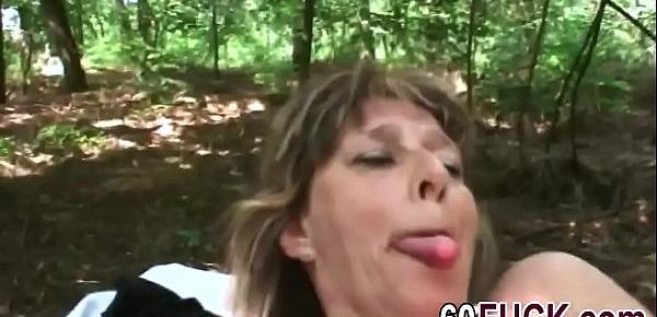  Nasty granny sucks cock and gets fucked in the woods